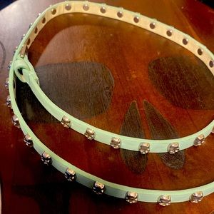Silver skull studded teal belt. 45 inches long